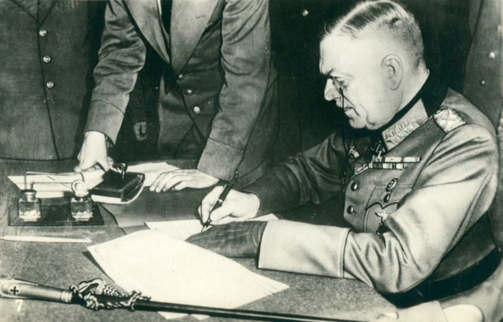 German Field Marshall Wilhelm Keitel signs a surrender document at Soviet headquarters in Berlin, May 9, 1945. The Soviets had insisted that a second ceremonial signing take place in Soviet-occupied Berlin.