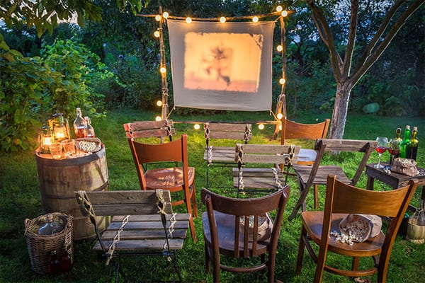 empty chairs facing slideshow projector screen