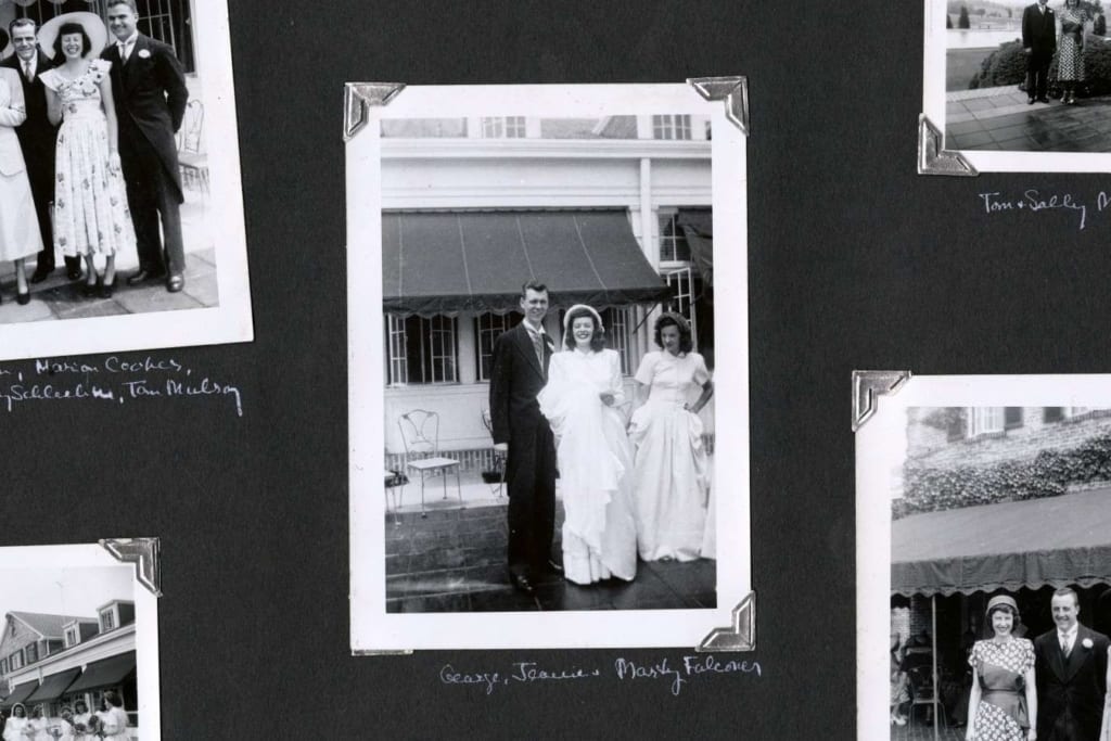partial photo album page from Jean Doern's wedding album with a photo of Jean and her husband George in the center