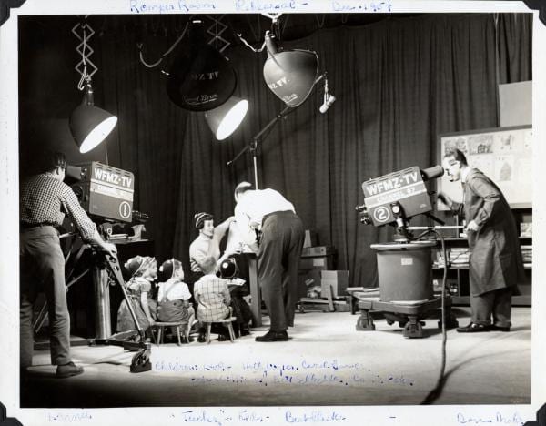 Jean Doern and a group of children rehearsing in front of cameras for the TV show Romper Room