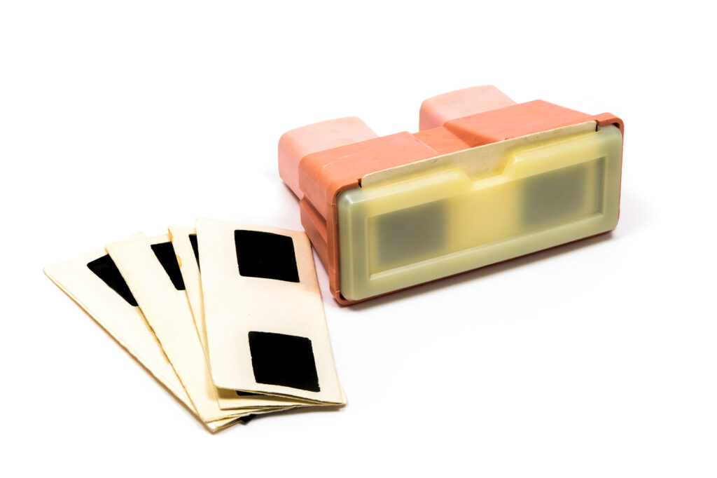 Red retro stereoscope with slides frames isolated on white background