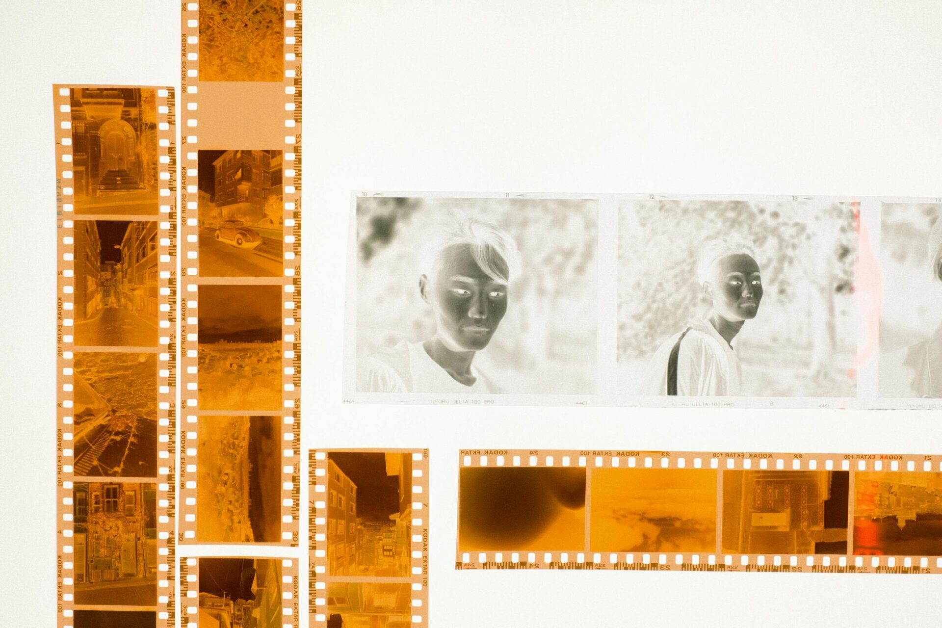 Colorful film strips and photo negatives arranged on a light table for a creative display.